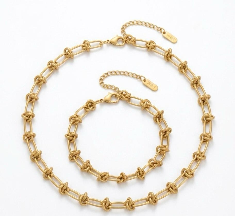 Gold chain necklace on a white background