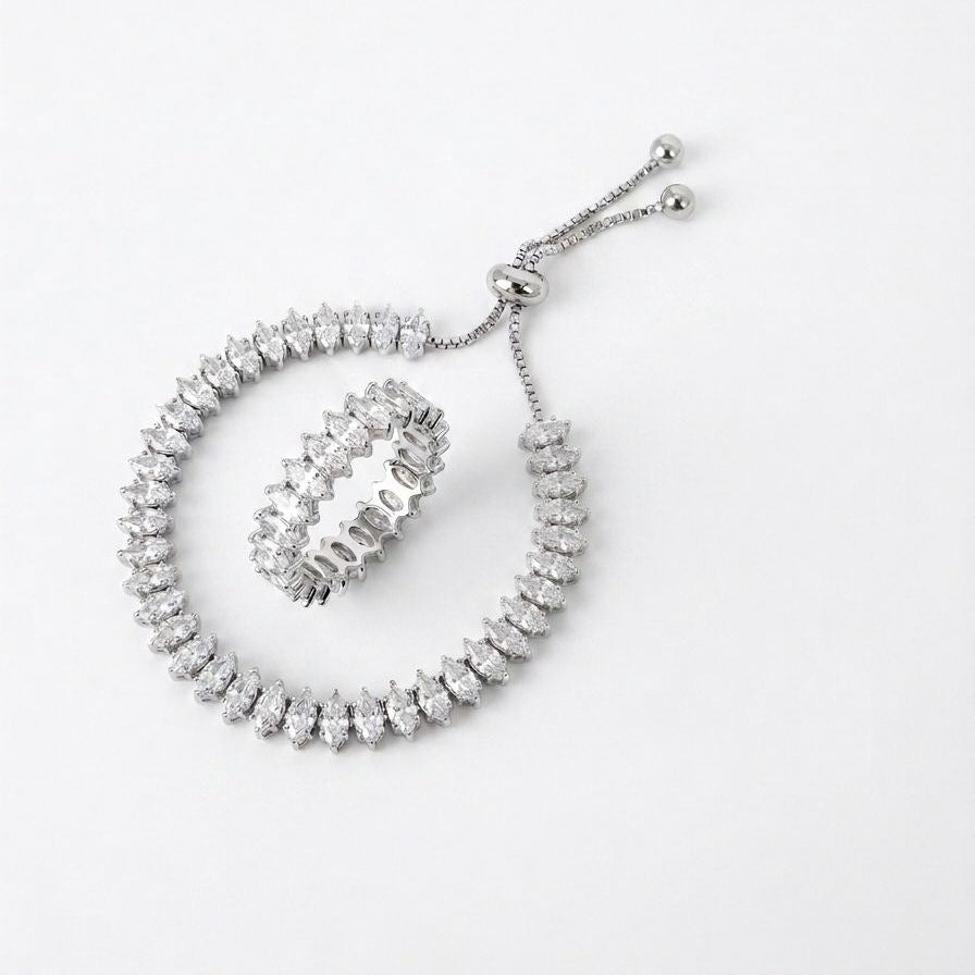 Silver bracelet with clear stones on a white background