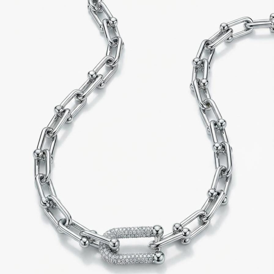 Silver chain necklace on a white background