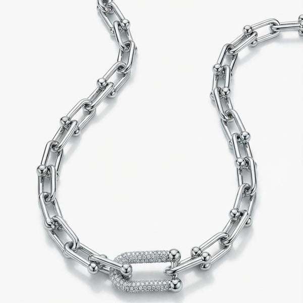 Silver chain necklace on a white background