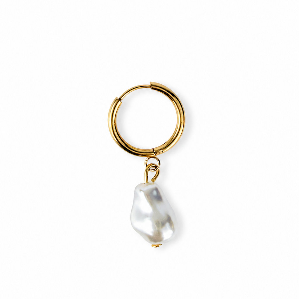 A gold hoop earring with a dangling baroque pearl, shown on a clean white background.