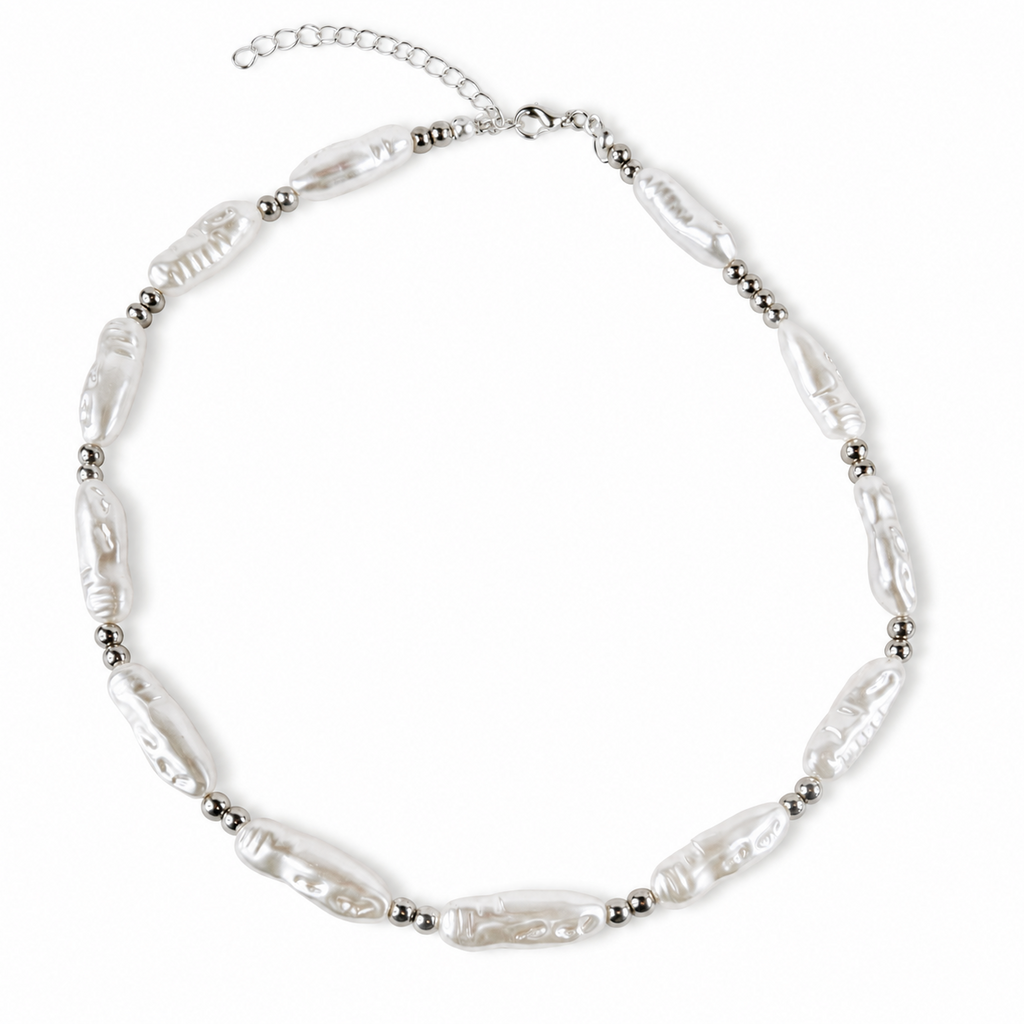 A silver-toned beaded necklace featuring irregular, baroque-style white pearls separated by small metallic beads, with a silver chain extender clasp, shown on a plain white background.