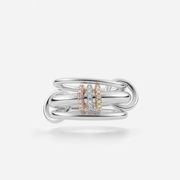 Silver ring with rose gold accents on a light gray background