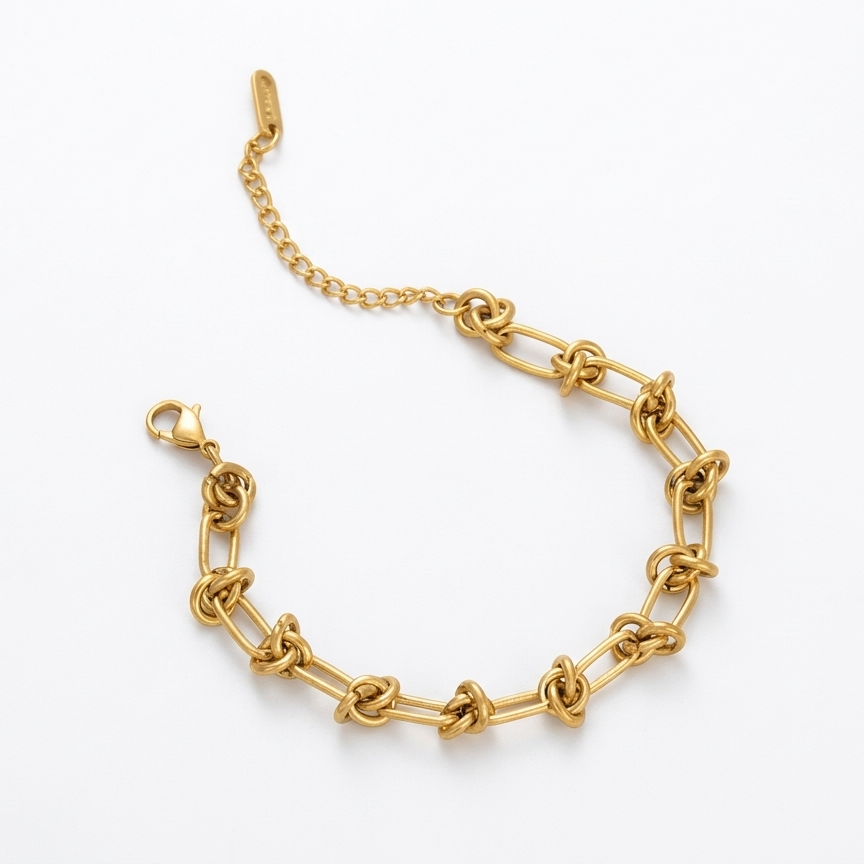 Gold chain bracelet on a white background