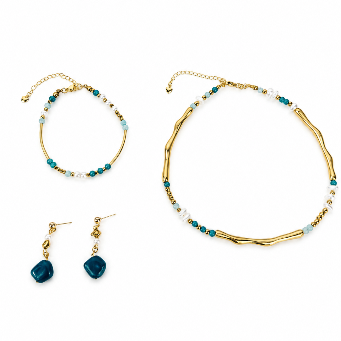 A gold jewelry set featuring a textured chain necklace, a beaded bracelet, and matching drop earrings with teal and white beads, displayed on a clean white background.